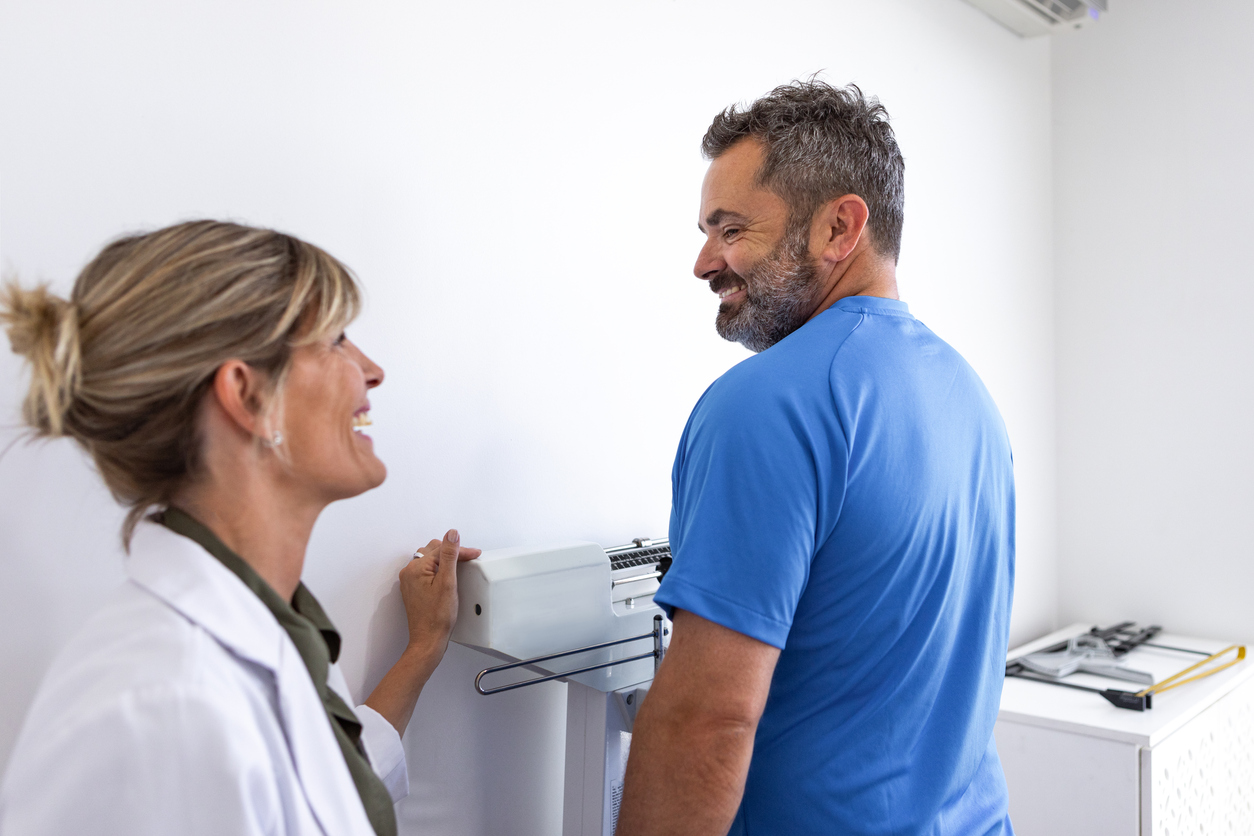Patient discussing a weight-loss plan with a medical professional
