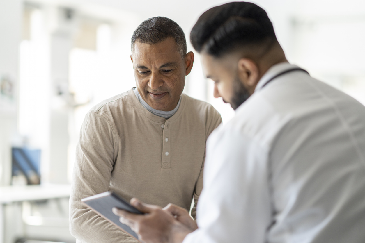 Physician explaining personalized therapy options to a patient